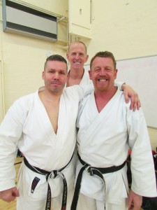 Darren Longstaff 5th Dan, Ray Hind 6th Dan congratulating Steve Chaplow with his 6th Dan Award